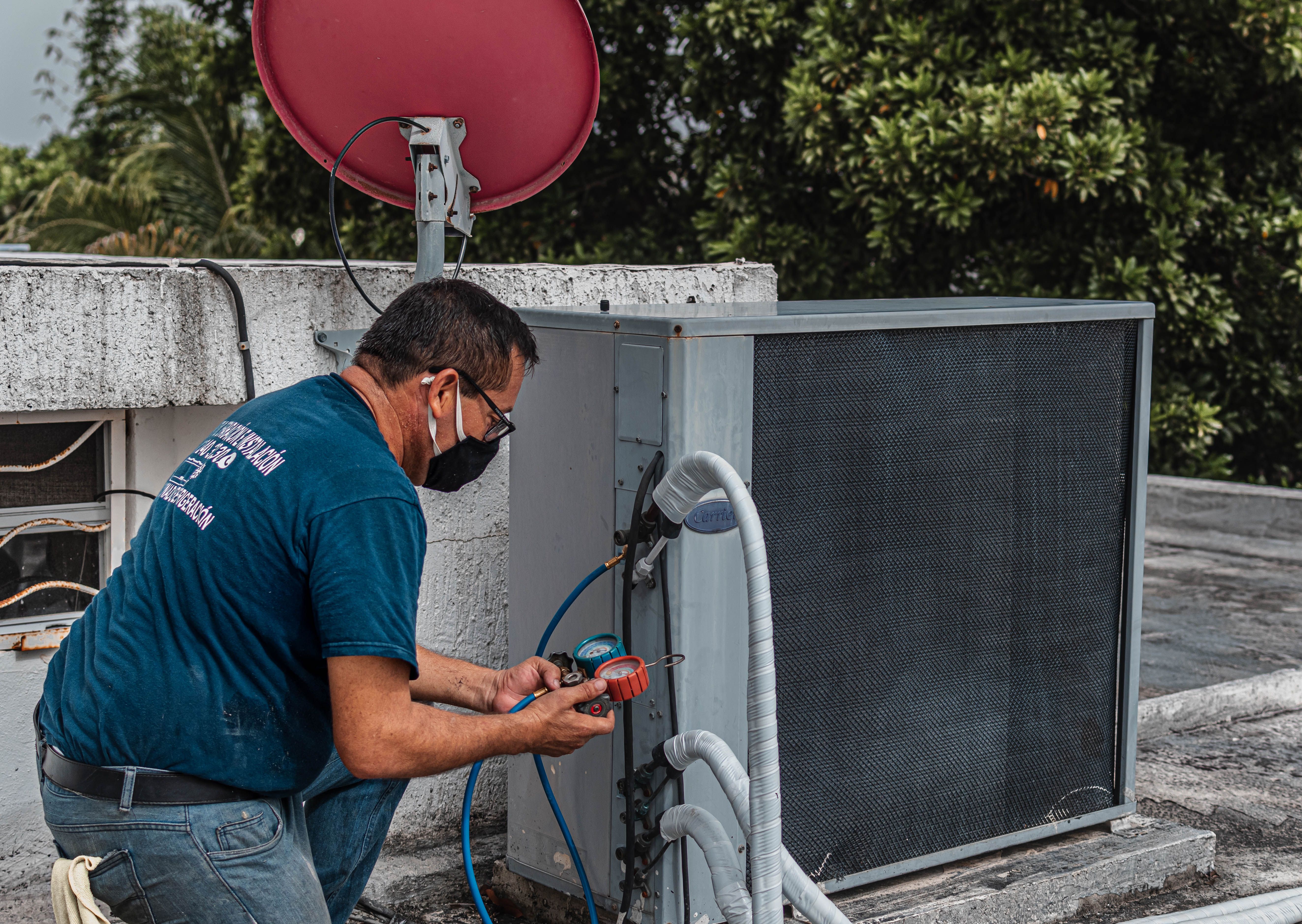 HVAC technician servicing a cooling unit